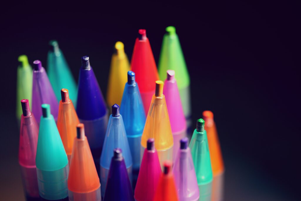 The tips of a collection of coloured pens