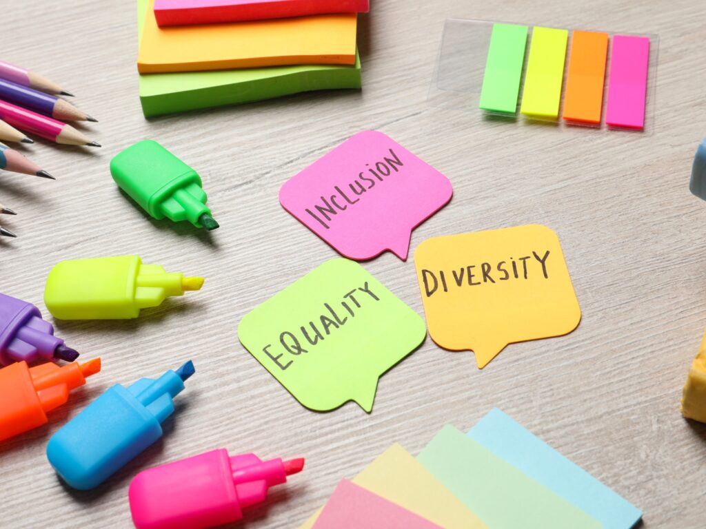 Multicoloured post-its and highlighter pens. Post-its in the middle read Equality, diversity, inclusion.
