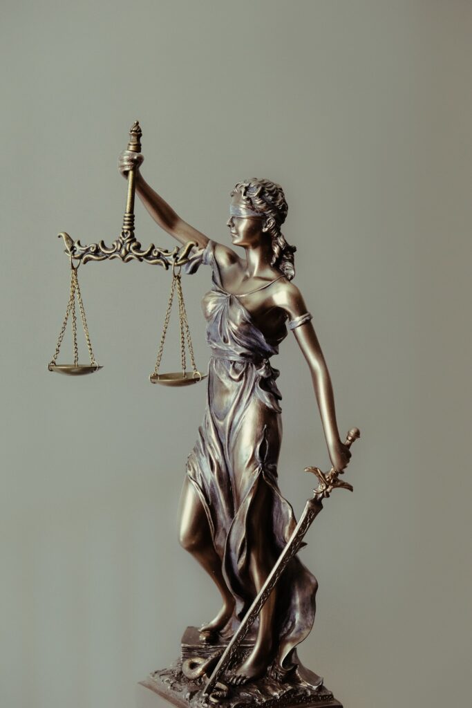 Desk ornament depicting a blind woman holding the scales of justice