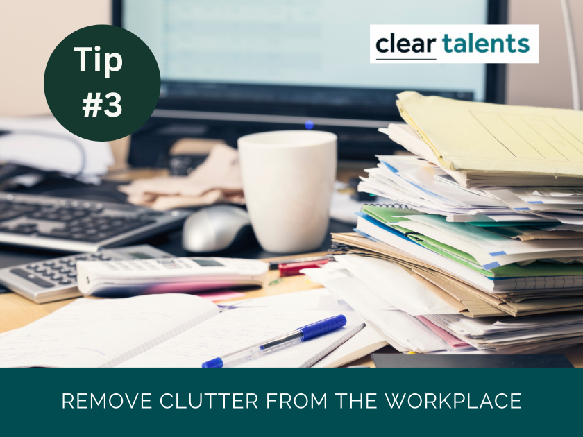 A picture of a cluttered office. Remove clutter from the workplace.