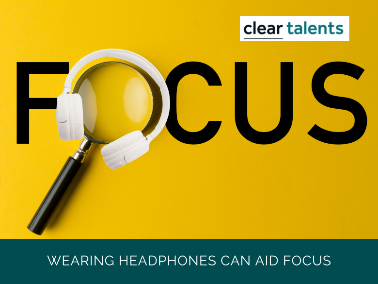 The word focus. The 'O' has a magnifying glass over it, which is surrounded by a pair of headphones