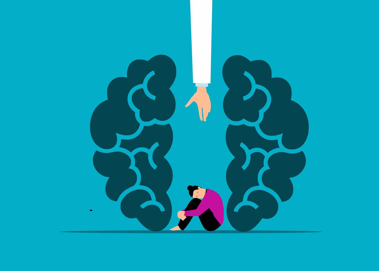 Image shows someone crouched at the bottom of a space between a stylised brain.
A hand reaches down from above offering support