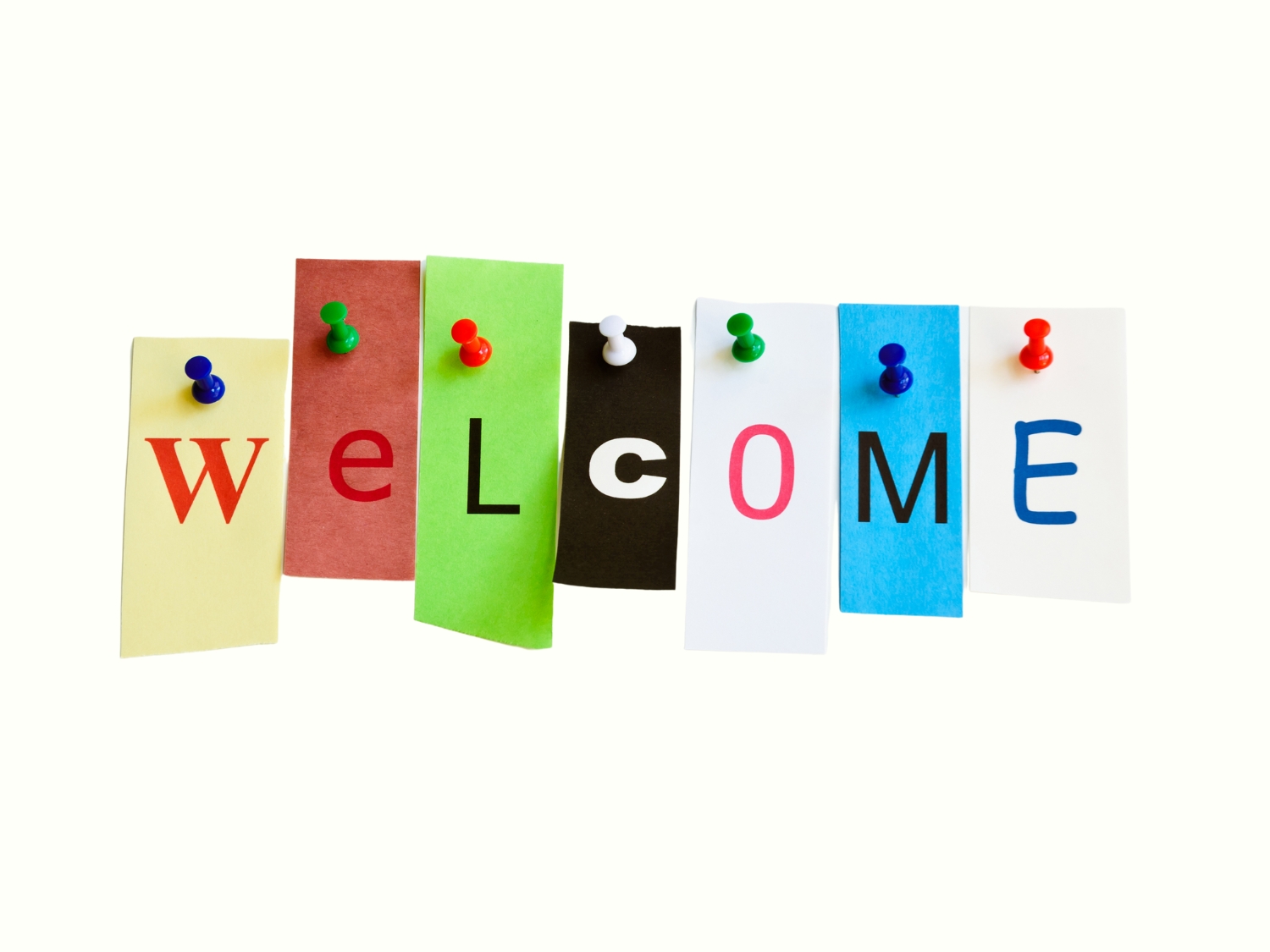 Letters pinned to a board on post-its spell the word "welcome"